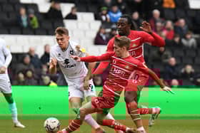 Scott Twine gets tackled by Doncaster’s Ethan Galbraith as Dons drew a blank on Saturday