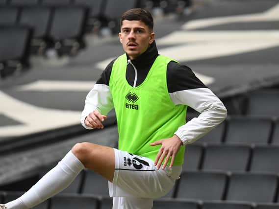 Jack Davies was on the bench for MK Dons on Saturday after he was recalled from his loan spell at Oxford City