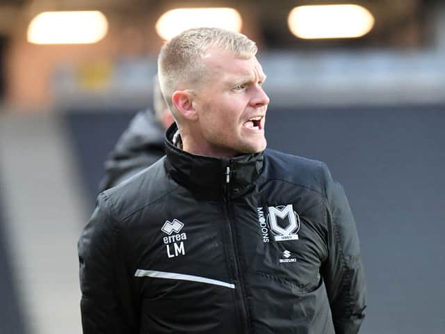<p>Liam Manning yells his orders to the players on the pitch, but off it, it has been a quiet start to the week</p>