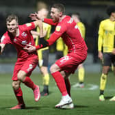 Scott Twine celebrates his stoppage time winner with Connor Wickham against Burton Albion
