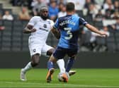 Hiram Boateng and Joe Jacobson fly into a challenge when Dons and Wycombe met back in September