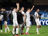 MK Dons celebrate with the travelling supporter after their win over Wycombe Wanderers