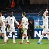 MK Dons celebrate their win over Wycombe Wanderers on Saturday