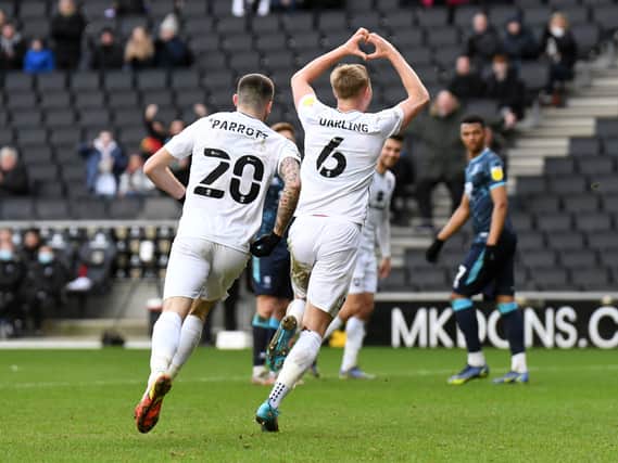 Harry Darling celebrates scoring Dons’ equaliser against Lincoln City. His goal just before half time was his fifth of the season.