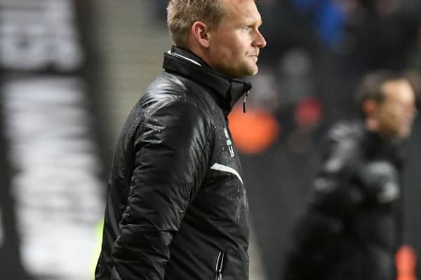 Liam Manning felt a point in adverse conditions at Fleetwood on Tuesday was a solid result for MK Dons