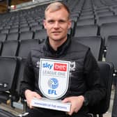 Liam Manning with his Manager of the Month trophy for January. He also won the prize for September