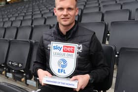 Liam Manning with his Manager of the Month trophy for January. He also won the prize for September