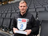 Liam Manning with his Manager of the Month trophy for January. He also won the prize for September