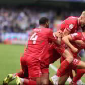 MK Dons celebrate Scott Twine’s brilliant free-kick during the 2-2 draw with Ipswich Town at Portman Road earlier this season