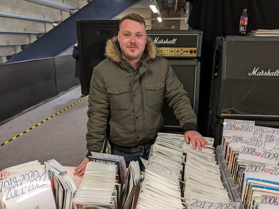 James Rees with some of the programmes for sale at the MKDSA shop