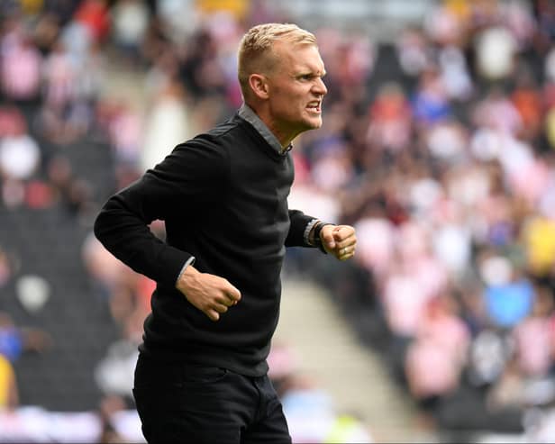 Liam Manning celebrates Troy Parrott’s goal in his first MK Dons game in charge, against Sunderland back in August