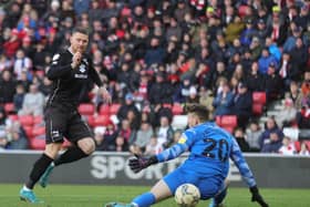 Connor Wickham needed just two minutes on the field before he coolly slotted past Anthony Patterson to restore Dons’ lead against his former club Sunderland