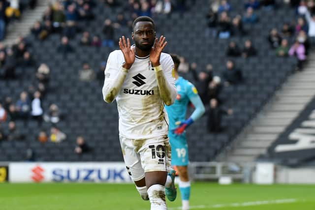 Mo Eisa celebrates his ninth goal of the season but his first at Stadium MK since August as he opens the scoring against Bolton