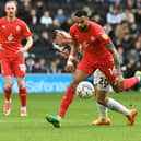 Curtis Tilt battles with Troy Parrott during Dons’ draw with Wigan Athletic. Speaking afterwards, Latics boss Leam Richardson felt his side could have been a bit more aggressive in the final third