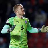 Wigan keeper Ben Amos celebrates. The Latics were 2-0 winners on Tuesday against bottom club Crewe Alexandra