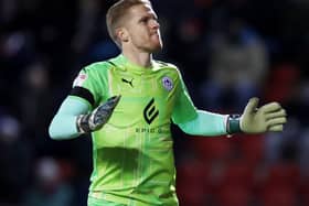 Wigan keeper Ben Amos celebrates. The Latics were 2-0 winners on Tuesday against bottom club Crewe Alexandra