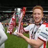 Dean Lewington of MK Dons celebrates after gaining promotion to the Championship in 2015. There are plenty of similarities between Dons’ run to automatic promotion that year and the one Liam Manning’s side are on at the moment