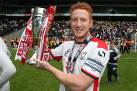 Dean Lewington of MK Dons celebrates after gaining promotion to the Championship in 2015. There are plenty of similarities between Dons’ run to automatic promotion that year and the one Liam Manning’s side are on at the moment