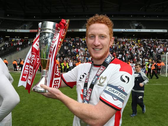 Dean Lewington of MK Dons celebrates after gaining promotion to the Championship in 2015. There are plenty of similarities between Dons’ run to automatic promotion that year and the one Liam Manning’s side are on at the moment
