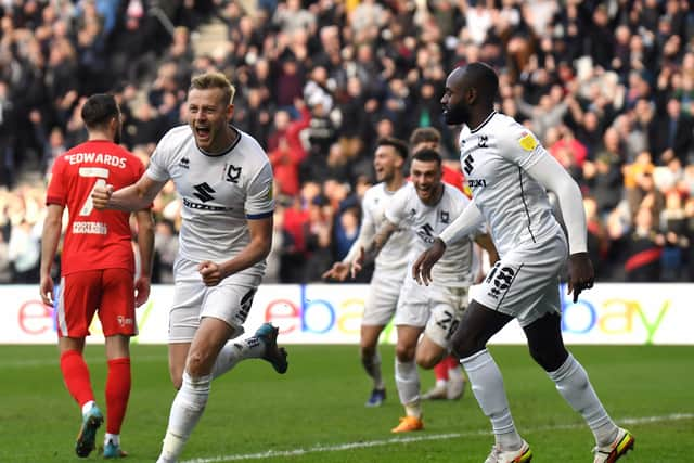 Harry Darling celebrates his eighth goal of the season, equalising late on against Wigan on Saturday