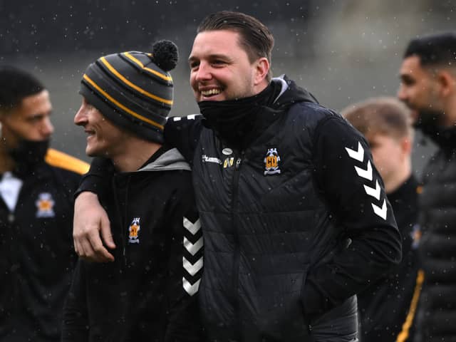 Cambridge United manager Mark Bonner with former MK Dons defender George Williams. Bonner called Dons one of the best teams in League One ahead of the game on Saturday.