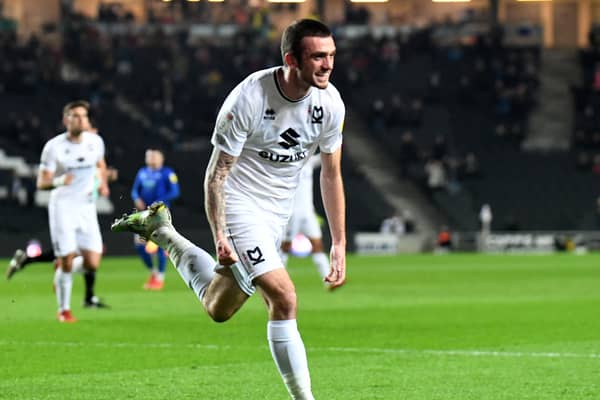Troy Parrott celebrates his first goal since November, coming against Cheltenham Town last week. The Irishman has been called up to represent his country again