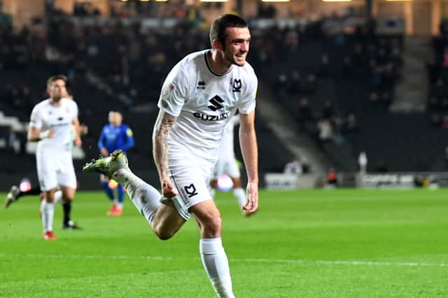 Troy Parrott celebrates his first goal since November, coming against Cheltenham Town last week. The Irishman has been called up to represent his country again