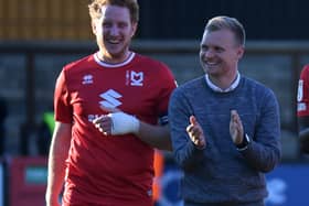 Dean Lewington and Liam Manning enjoy a moment after MK Dons’ 1-0 win over Cambridge United. Lewington said Manning’s approach at Stadium MK has freed them up to play a style of football to get them up the table this season.