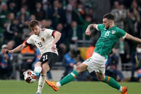 Troy Parrott vies with Belgium’s Thomas Foket during their friendly on Saturday night