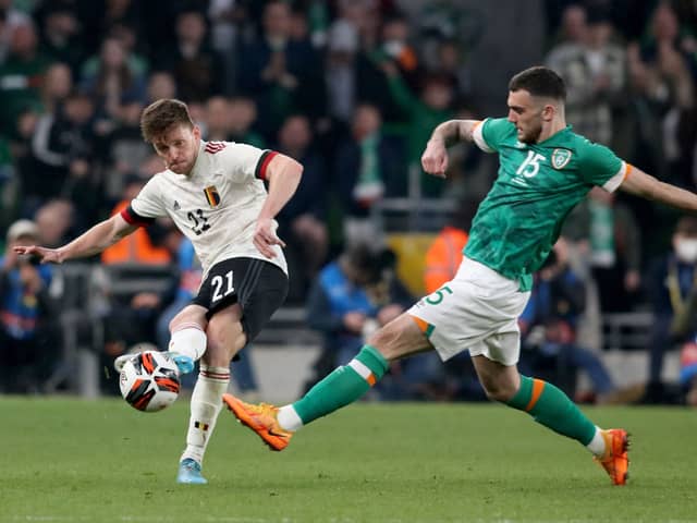 Troy Parrott vies with Belgium’s Thomas Foket during their friendly on Saturday night