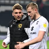 Chris Hogg and Harry Darling in discussion after a game. Hogg was deemed the mastermind behind Dons’ newfound potency from set-pieces but he insists it’s the players who should take the praise