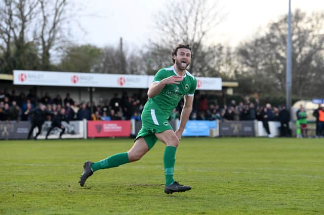 James Sage celebrates his winning penalty for Newport Pagnell Town. They will go to Wembley in May for the FA Vase final