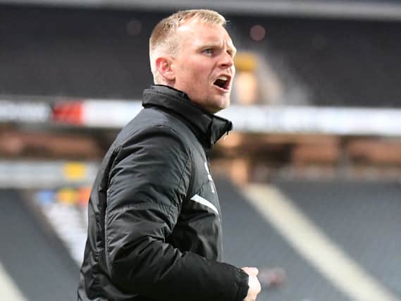 Liam Manning said there is no extra pressure on his side despite climbing into the automatic spots on Tuesday night after beating Crewe Alexandra