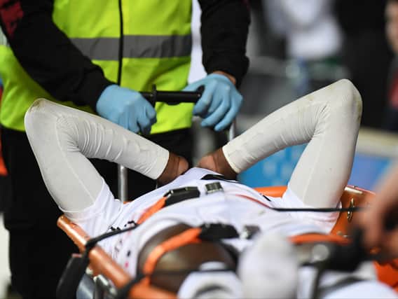 Mo Eisa left the field on a stretcher on Saturday with his right ankle strapped up. The striker will miss the remainder of the season, having scored 12 goals for Dons this term.
