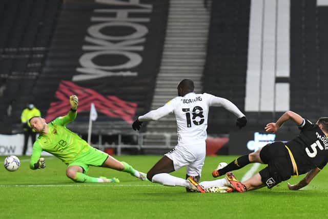 Hiram Boateng gave Dons the lead when they last played Oxford at Stadium MK in December.