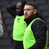 Striker Connor Wickham will face a late fitness test on Friday after missing Tuesday’s game with Oxford. His absence, and Mo Eisa’s long-term injury, leave Dons short on numbers up front.