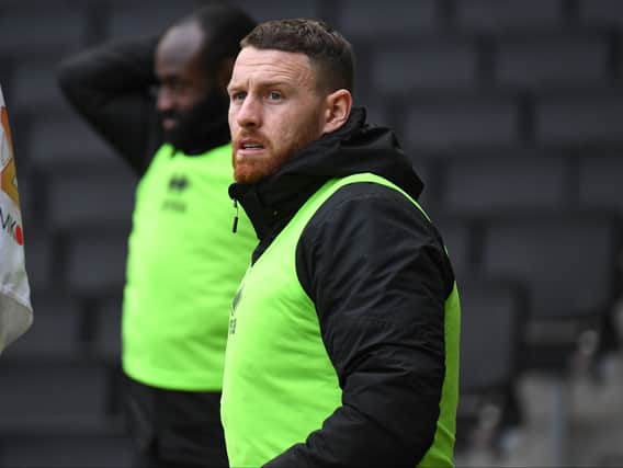 Striker Connor Wickham will face a late fitness test on Friday after missing Tuesday’s game with Oxford. His absence, and Mo Eisa’s long-term injury, leave Dons short on numbers up front.