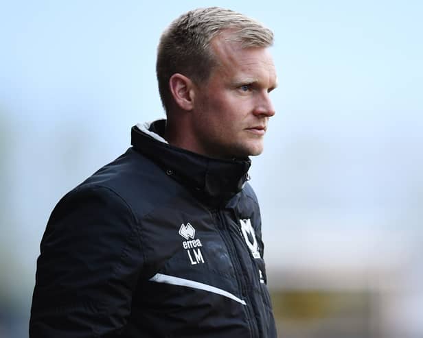 Liam Manning watches on from the sidelines at the Kassam Stadium. He said after a meeting with his players on Thursday, they have drawn a line under their recent defeats and are ready to move on against Morecambe on Saturday
