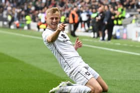 Harry Darling celebrates his first class goal against Morecambe at Stadium MK. It was the defender’s ninth goal of the season, and put them in pole position to take the three points on Saturday.