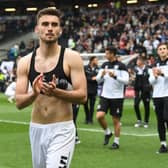 Warren O’Hora during MK Dons’ lap of appreciation last weekend. The Irish defender said even though the results in the week fell kindly for Dons, their task remains the same heading into the final game of the season