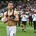 Warren O’Hora during MK Dons’ lap of appreciation last weekend. The Irish defender said even though the results in the week fell kindly for Dons, their task remains the same heading into the final game of the season