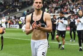 Warren O’Hora during MK Dons’ lap of appreciation last weekend. The Irish defender said even though the results in the week fell kindly for Dons, their task remains the same heading into the final game of the season