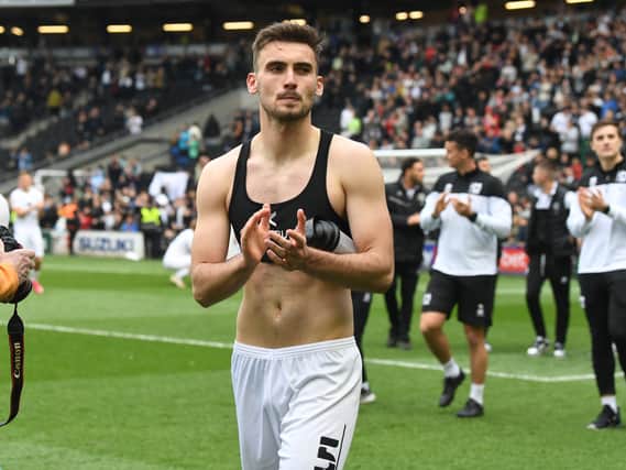 Warren O’Hora during MK Dons’ lap of appreciation last weekend. The Irish defender said even though the results in the week fell kindly for Dons, their task remains the same heading into the final game of the season