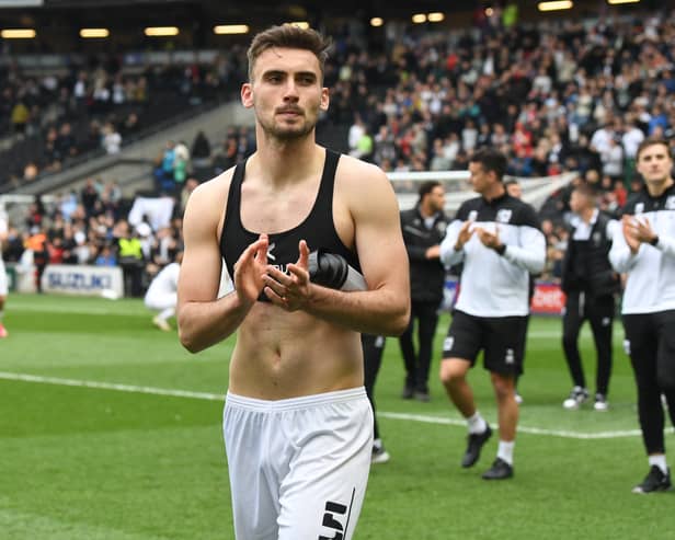 Warren O’Hora during MK Dons’ lap of appreciation last weekend. The Irish defender said even though the results in the week fell kindly for Dons, their task remains the same heading into the final game of the season