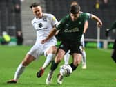 Josh McEachran battles for the ball when Dons met Plymouth back in December. Both sides need to win on the final day of the season when they play at Home Park