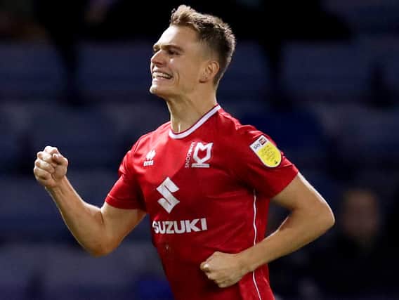 Scott Twine was named League One’s Player of the Season and netted four brilliant goals against Plymouth on Saturday as Dons ran riot in a 5- win