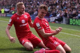 Scott Twine celebrates with fellow goal-scorer Harry Darling during the win over Plymouth Argyle. Twine netted four goals at Home Park to take his tally to 20 for the season.