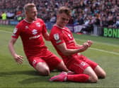 Scott Twine celebrates with fellow goal-scorer Harry Darling during the win over Plymouth Argyle. Twine netted four goals at Home Park to take his tally to 20 for the season.