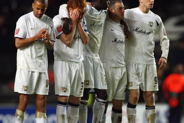 MK Dons players during the penalty shoot-out against Scunthorpe at Stadium MK