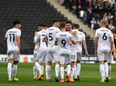 MK Dons celebrate Daniel Harvie’s goal against Morecambe. Although they missed out on automatic promotion, going up via the play-offs is still a possibility.